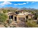 Luxury home exterior with mountain views and desert landscaping at 9270 E Thompson Peak Pkwy # 335, Scottsdale, AZ 85255