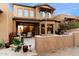 Home's exterior boasts a large patio and desert landscaping at 9270 E Thompson Peak Pkwy # 335, Scottsdale, AZ 85255