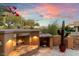 Outdoor fireplace with seating area on a large patio at 9270 E Thompson Peak Pkwy # 335, Scottsdale, AZ 85255