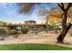 Backyard view of a two-story house with desert landscaping at 9270 E Thompson Peak Pkwy # 335, Scottsdale, AZ 85255