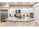 Modern kitchen with stainless steel appliances and large island at 9270 E Thompson Peak Pkwy # 335, Scottsdale, AZ 85255