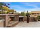 Outdoor patio with fireplace, seating, and mountain views at 9270 E Thompson Peak Pkwy # 335, Scottsdale, AZ 85255