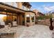 Spacious patio with built-in grill, fireplace, and seating area at 9270 E Thompson Peak Pkwy # 335, Scottsdale, AZ 85255