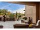 Covered patio with mountain views, fireplace and seating area at 9270 E Thompson Peak Pkwy # 335, Scottsdale, AZ 85255