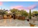 Patio features a fireplace, water feature and mountain views at 9270 E Thompson Peak Pkwy # 335, Scottsdale, AZ 85255