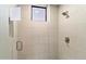 Walk-in shower with glass enclosure and neutral tile at 9270 E Thompson Peak Pkwy # 335, Scottsdale, AZ 85255