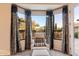 Relaxing sitting area with mountain views and plush chair at 9270 E Thompson Peak Pkwy # 335, Scottsdale, AZ 85255