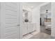 Double vanity bathroom with gray flooring and a view of the bedroom at 9316 S 39Th Dr, Laveen, AZ 85339