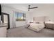 Spacious bedroom with large bed, nightstands, and a full-length mirror at 9316 S 39Th Dr, Laveen, AZ 85339