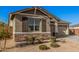 Single-story home with neutral exterior, two-car garage, and landscaping at 9316 S 39Th Dr, Laveen, AZ 85339