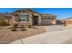 One-story home with stone accents and a two-car garage at 9316 S 39Th Dr, Laveen, AZ 85339