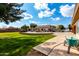 Large backyard with grassy lawn, patio and pool area visible at 9613 W Camino De Oro Dr, Peoria, AZ 85383