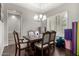 Elegant dining room features a large wood table with ornate chairs at 9613 W Camino De Oro Dr, Peoria, AZ 85383