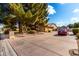 Home's side view, showcasing garage and landscaping at 9613 W Camino De Oro Dr, Peoria, AZ 85383