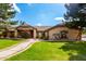 House exterior with manicured lawn and walkway at 9613 W Camino De Oro Dr, Peoria, AZ 85383