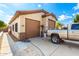 Attached garage with double doors at 9613 W Camino De Oro Dr, Peoria, AZ 85383