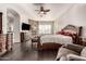 Main bedroom with fireplace, walk-in closet, and ensuite bathroom at 9613 W Camino De Oro Dr, Peoria, AZ 85383