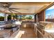 Outdoor kitchen features built-in grill, sink, and ample counter space at 9613 W Camino De Oro Dr, Peoria, AZ 85383