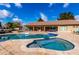 Large kidney-shaped pool with spa and spacious patio at 9613 W Camino De Oro Dr, Peoria, AZ 85383