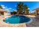 Inviting kidney shaped pool with basketball hoop at 9613 W Camino De Oro Dr, Peoria, AZ 85383