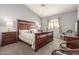 Main bedroom with a king-size bed and wood furniture at 10401 N 52Nd St # 208, Paradise Valley, AZ 85253