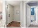 Condo entry hall with wood-look floors and access to bathroom at 10401 N 52Nd St # 208, Paradise Valley, AZ 85253