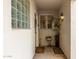 Condo entryway with glass block window and potted plants at 10401 N 52Nd St # 208, Paradise Valley, AZ 85253
