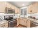 Well-equipped kitchen, granite counters, stainless steel appliances at 10401 N 52Nd St # 208, Paradise Valley, AZ 85253