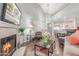 Bright living room with fireplace, hardwood floors, and comfortable seating at 10401 N 52Nd St # 208, Paradise Valley, AZ 85253