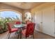 Outdoor patio with seating for four and storage closet at 10401 N 52Nd St # 208, Paradise Valley, AZ 85253