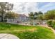 View of community pool and surrounding green space at 10401 N 52Nd St # 208, Paradise Valley, AZ 85253