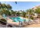 Community pool with lounge chairs and umbrellas at 10401 N 52Nd St # 208, Paradise Valley, AZ 85253