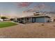 View of home's exterior and landscaped backyard at 10611 W Caron Dr, Sun City, AZ 85351