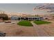 Artificial turf, brick pathway, and firepit in backyard at 10611 W Caron Dr, Sun City, AZ 85351