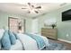 Spacious bedroom with light walls and a dresser at 10611 W Caron Dr, Sun City, AZ 85351