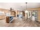 Spacious kitchen with island, granite countertops, and wood cabinets at 10611 W Caron Dr, Sun City, AZ 85351