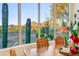 Bright dining area with mountain views and wooden table at 10760 E Caribbean Ln, Scottsdale, AZ 85255