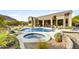 Resort-style pool and spa, surrounded by desert landscaping at 11329 E Diamond Cholla Dr, Scottsdale, AZ 85255