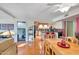 Bright dining area with hardwood floors and kitchen access at 115 W Echo Ln, Phoenix, AZ 85021