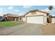 House exterior with attached garage and driveway at 12558 W Holly St, Avondale, AZ 85392