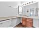 Bathroom features a vanity with wood cabinets and a large mirror at 1331 W Baseline Rd # 316, Mesa, AZ 85202