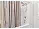 Bathroom with shower/tub combo and beige shower curtain at 1331 W Baseline Rd # 316, Mesa, AZ 85202