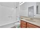 Clean bathroom, wood vanity, and a shower/tub combo at 1331 W Baseline Rd # 316, Mesa, AZ 85202