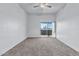 Spacious bedroom with carpet flooring and sliding glass door to balcony at 1331 W Baseline Rd # 316, Mesa, AZ 85202