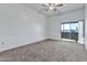 Bright bedroom featuring sliding glass door to balcony at 1331 W Baseline Rd # 316, Mesa, AZ 85202