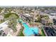 Aerial view of community pool, spa, and surrounding buildings at 1331 W Baseline Rd # 316, Mesa, AZ 85202