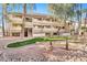 Two-story condo building with landscaping and a grassy area at 1331 W Baseline Rd # 316, Mesa, AZ 85202