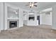 Open living room with kitchen views and a fireplace at 1331 W Baseline Rd # 316, Mesa, AZ 85202