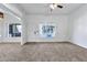 Spacious living room with carpeted floors and a ceiling fan at 1331 W Baseline Rd # 316, Mesa, AZ 85202