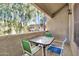 Private patio with table and chairs, offering treetop views at 1331 W Baseline Rd # 316, Mesa, AZ 85202